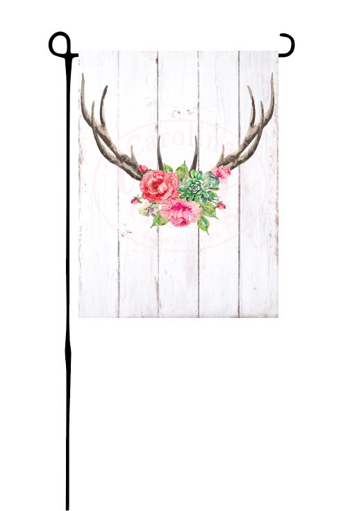 Antlers with flowers on faux wood